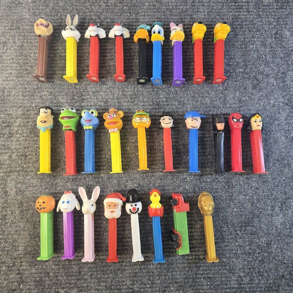 90's Pez Dispenser Lot Of 27 Lonney Toons DC Garfield Flintstone Peanuts Holiday